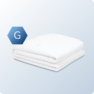 An image of the GlacioTex Cooling Mattress Protector on a blue background gradient