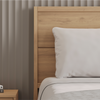 A closeup image of the Ludlow Bed Frame  in a bedroom scene