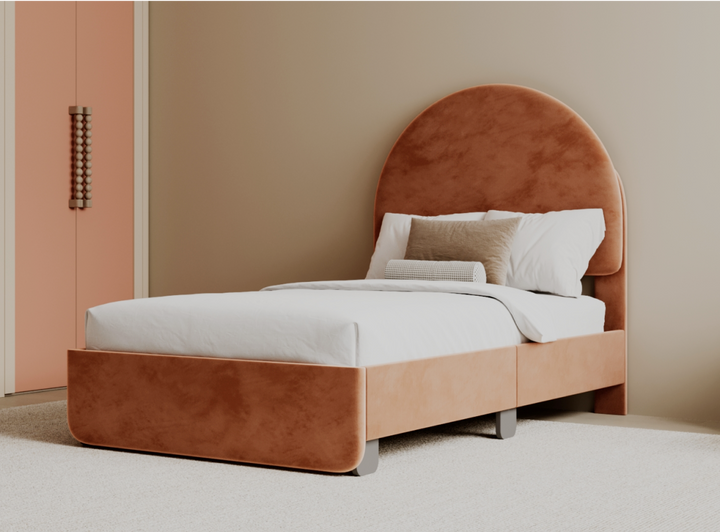 A lifestyle image of the Astor Bed Frame in the Dusty Rose color