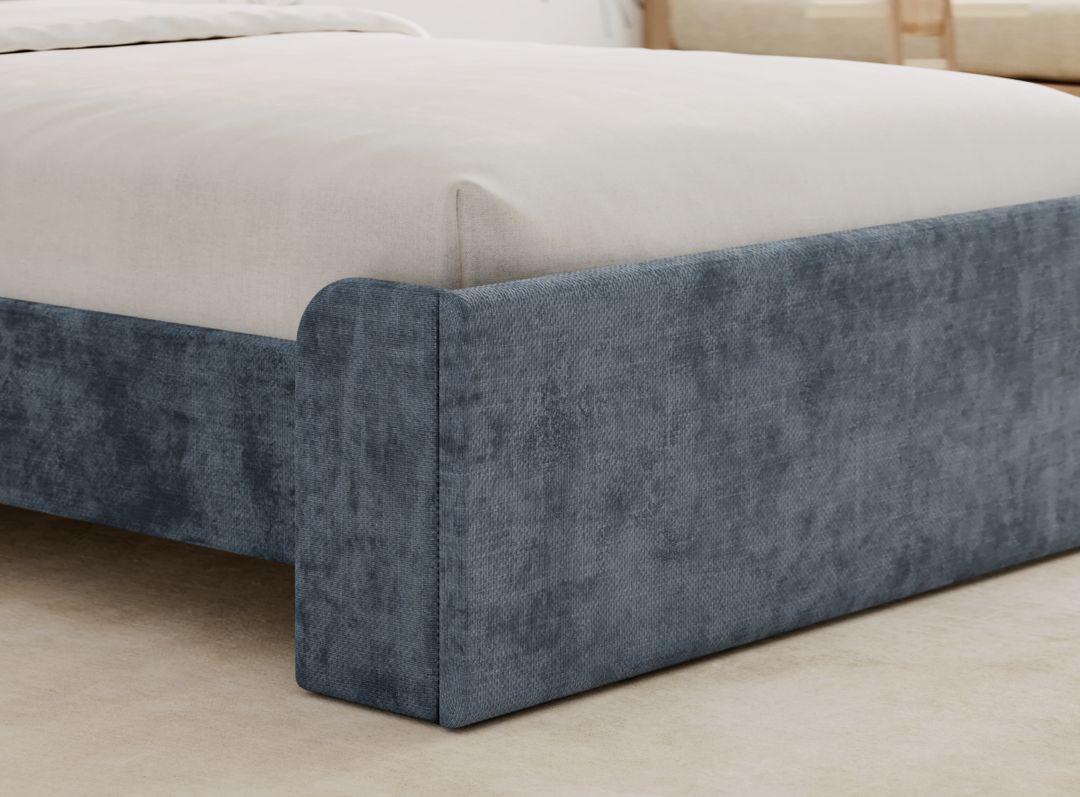 A closeup image of the Astor Bed Frame in the Blue color showing its upholstered fabric