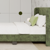 A closeup image of the Astor Bed Frame showcasing its headboard and upholstered fabric