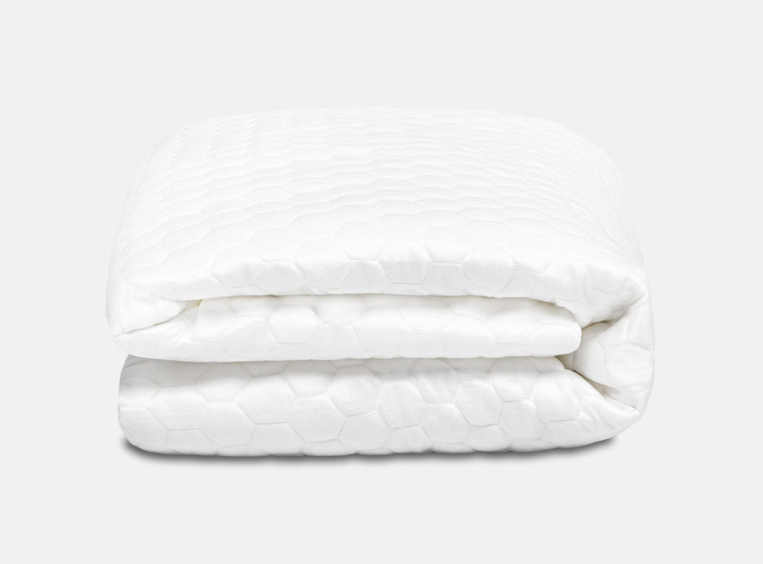 An image of the GlacioTex Mattress Protector folded up on a white background