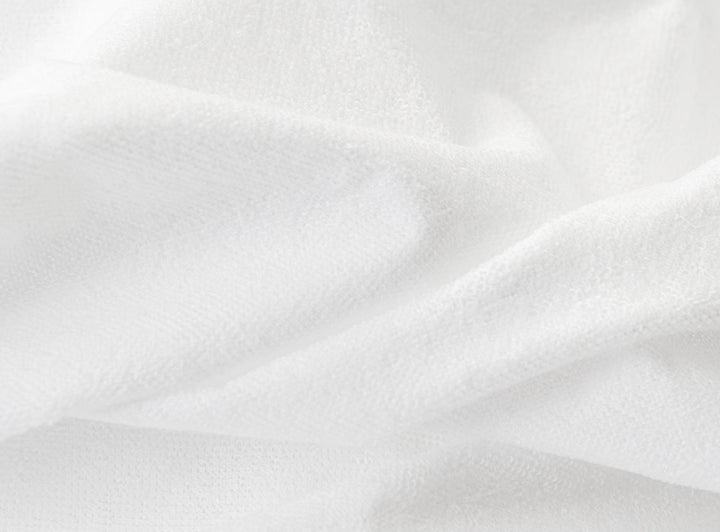 A closeup of the Waterproof Mattress Protector showing it's soft, waterproof fibers