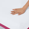 Hand pressing down on the medium feel Helix Dusk Mattress
